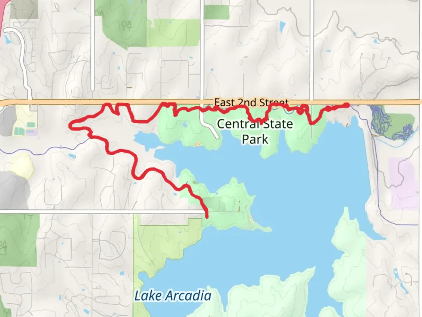 An image depicting the trail Edmond and Central State Park - Spring Creek Trail and its surrounding area.