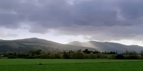 An image depicting the trail Knockmealdowns Trails - Sheep Hill Loop and its surrounding area.