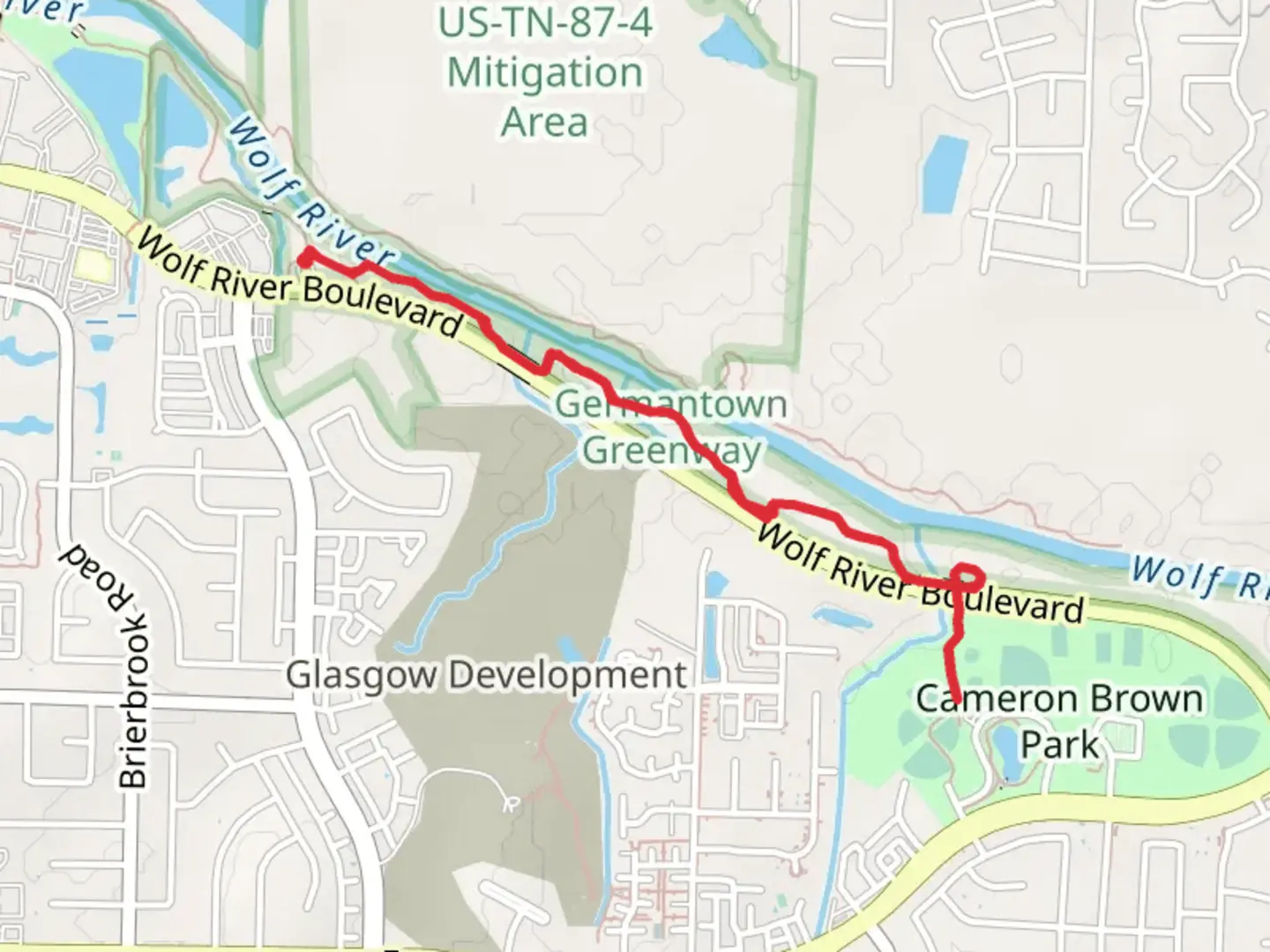 An image depicting the trail Wolf River Shore Walk to Cameron Brown Park and its surrounding area.