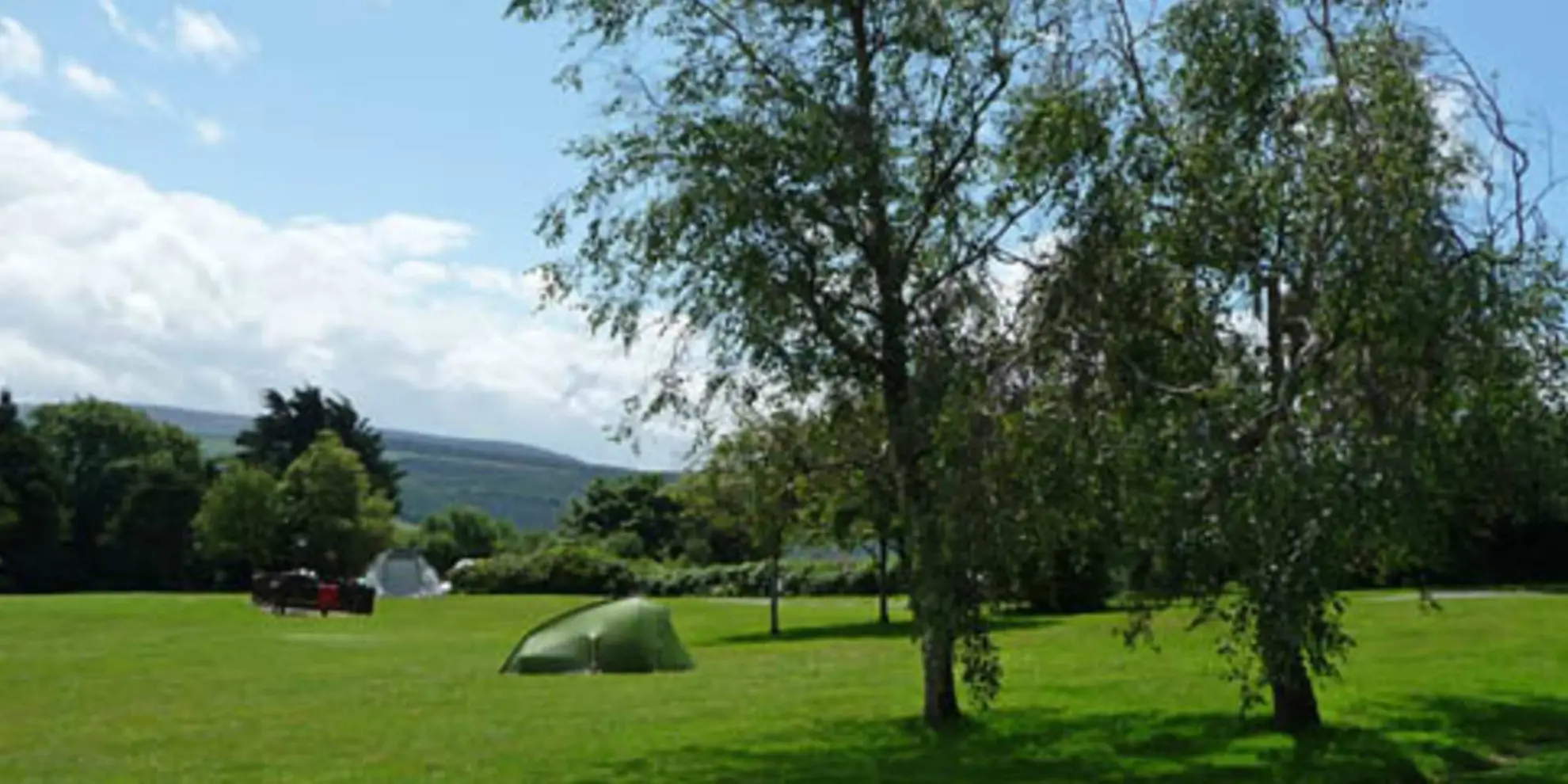An image depicting the trail Wood Combe Walk and its surrounding area.