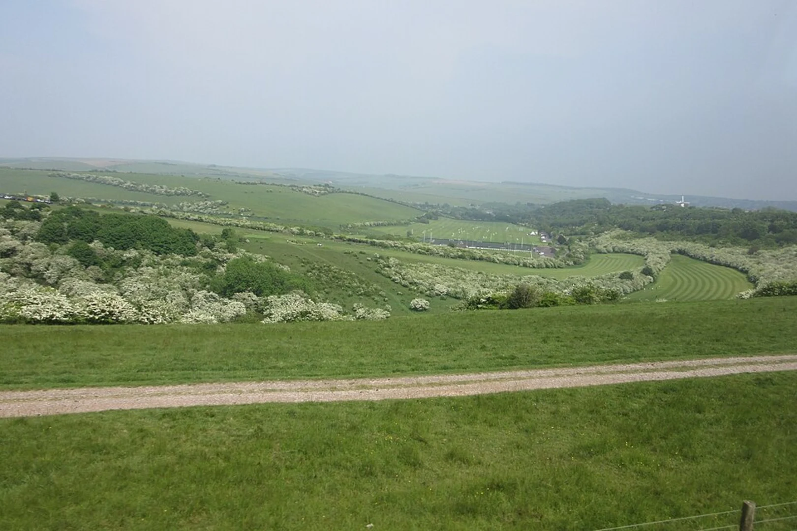 An image depicting the trail Stanmer to Pyecombe Loop via Devil's Dyke and its surrounding area.