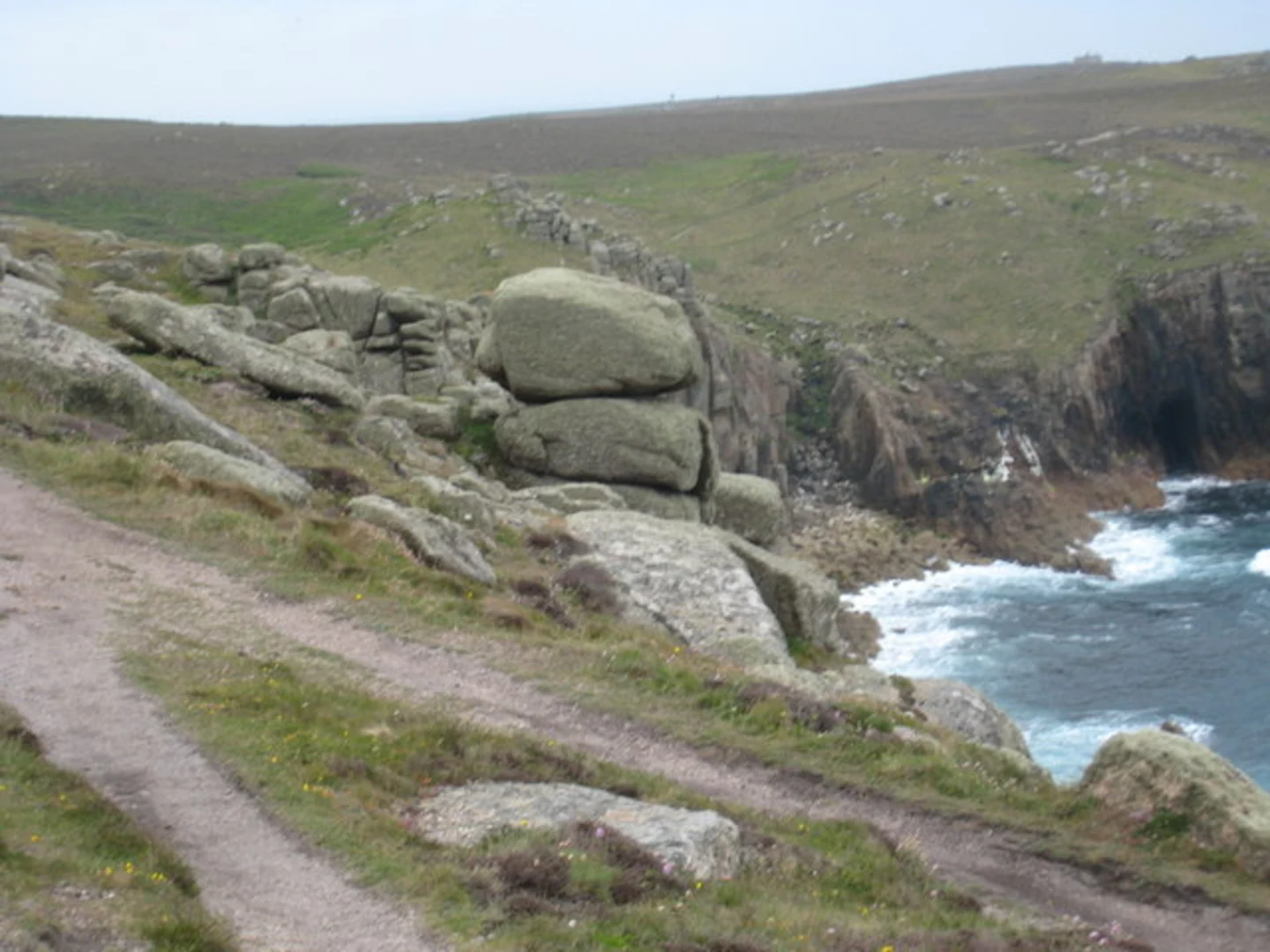 An image depicting the trail Porthcurno to St Just Coastal Walk and its surrounding area.