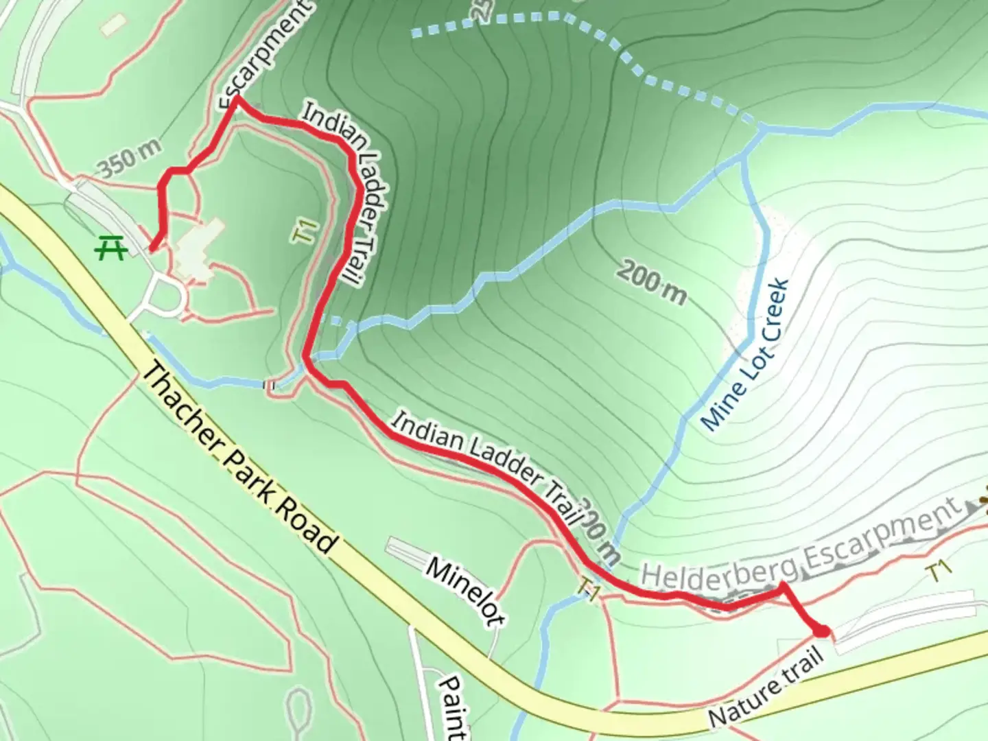 An image depicting the trail Mine Lot Creek via Escarpment Trail and its surrounding area.