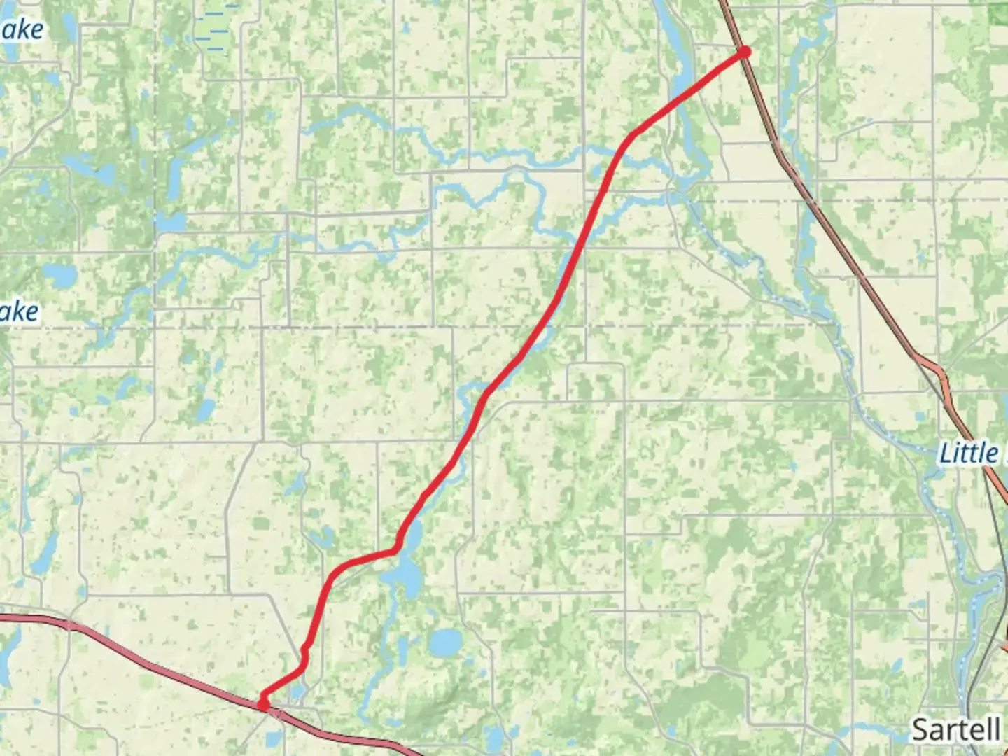 An image depicting the trail Lake Wobegon Regional Trail and its surrounding area.