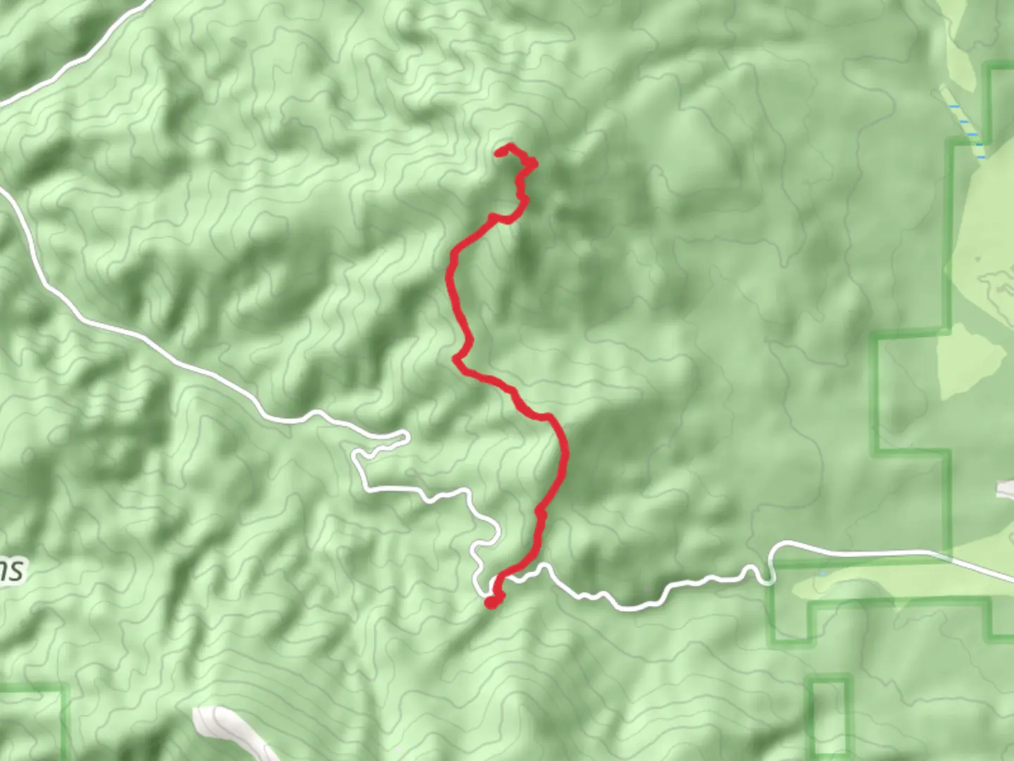 An image depicting the trail Round Mountain Trail - Forest Road 42 and its surrounding area.