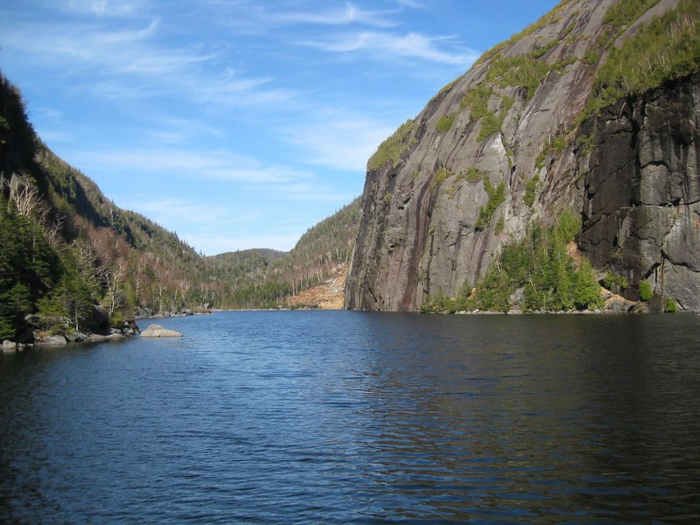 An image depicting the trail Algonquin Peak and Avalanche Lake Loop Trail via Heart Lake and its surrounding area.