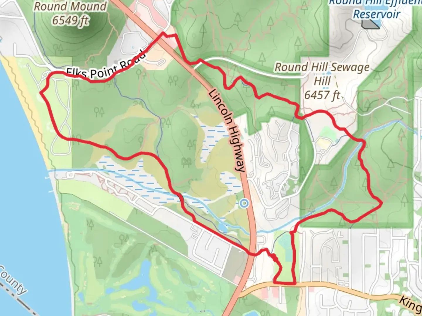An image depicting the trail Round Hill Sewage Hill Loop and its surrounding area.