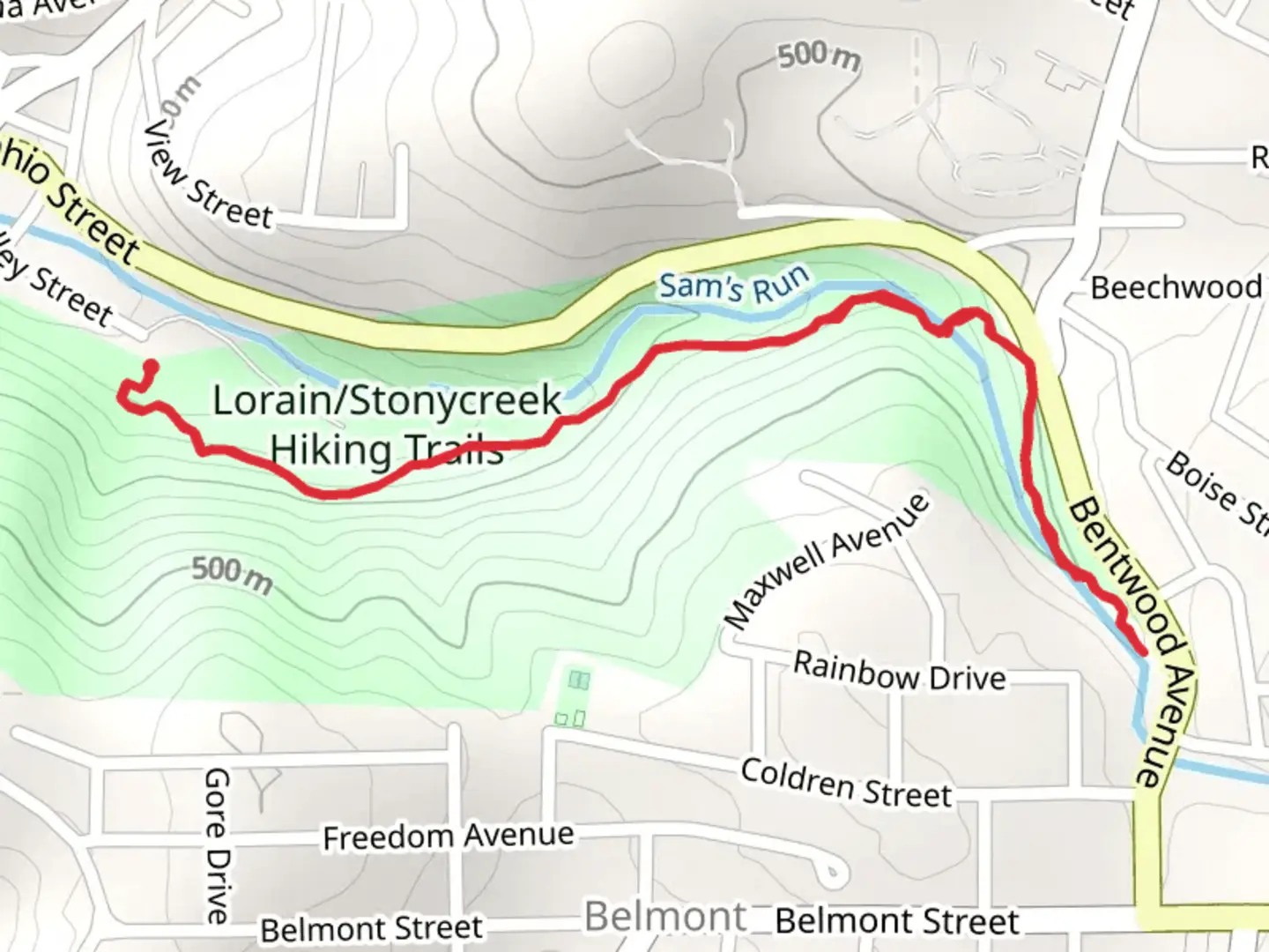 An image depicting the trail Sam's Run in Lorain Park and its surrounding area.