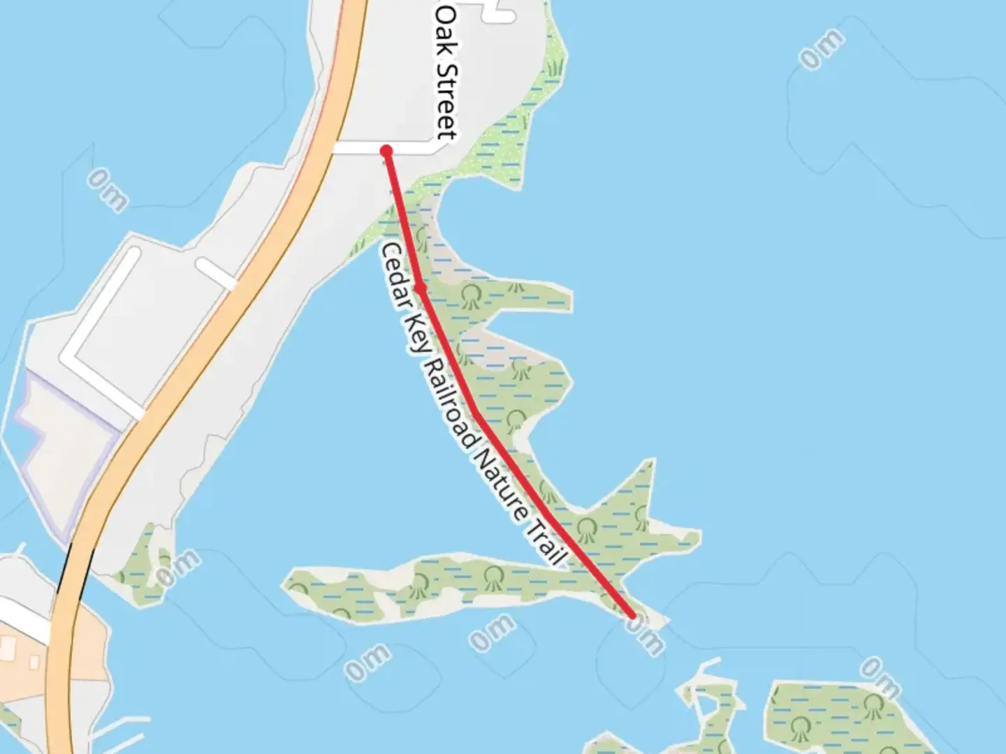 An image depicting the trail Cedar Key Railroad Nature Trail and its surrounding area.