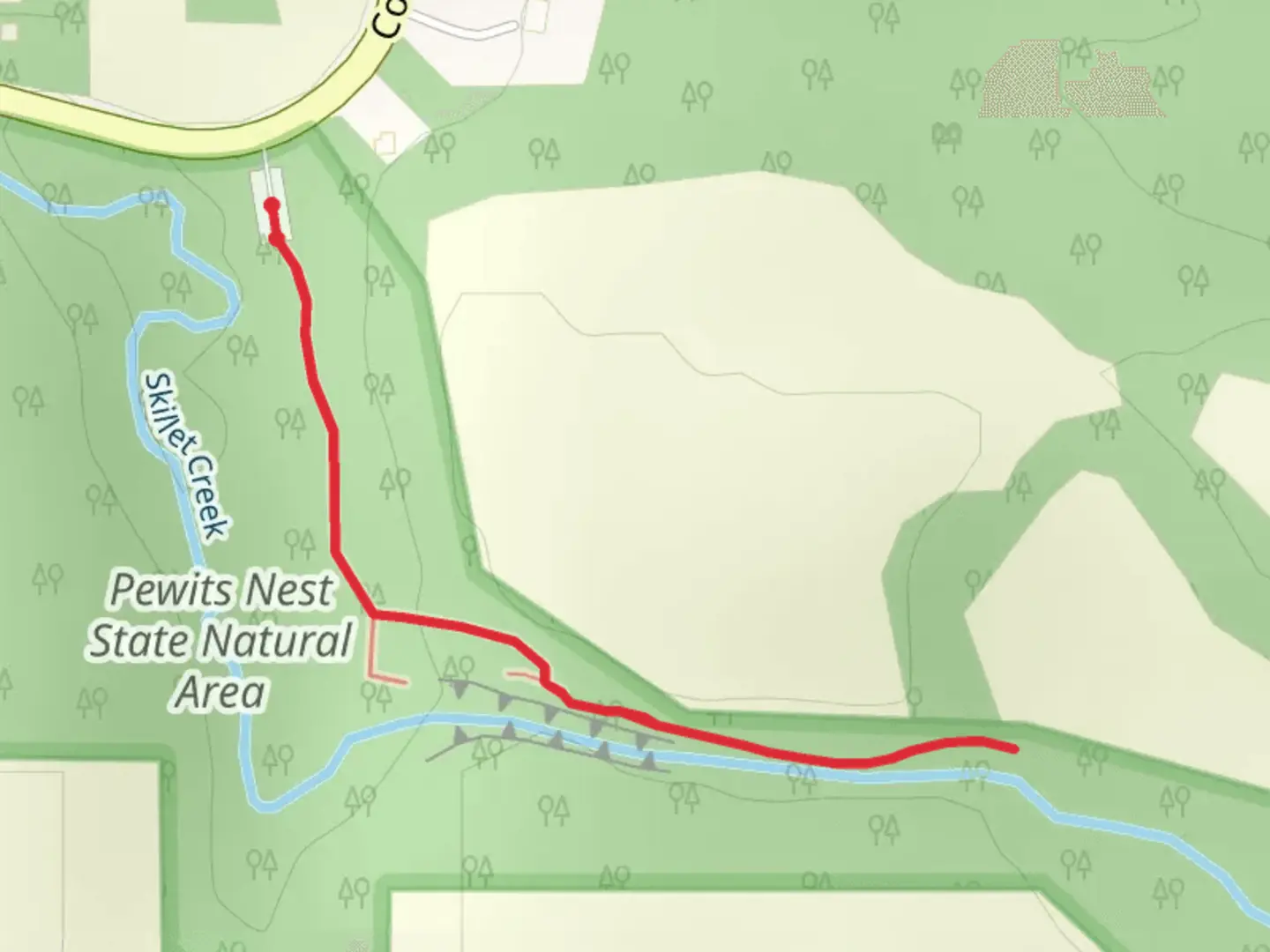 An image depicting the trail Pewits Nest State Natural Area and its surrounding area.