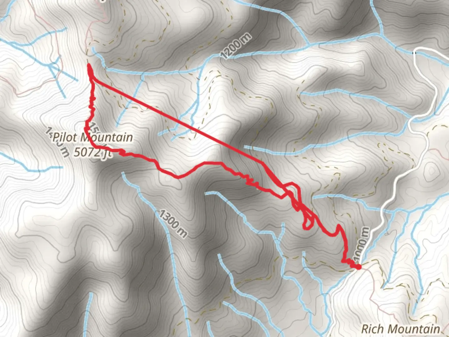 An image depicting the trail Pilot Mountain Loop and its surrounding area.