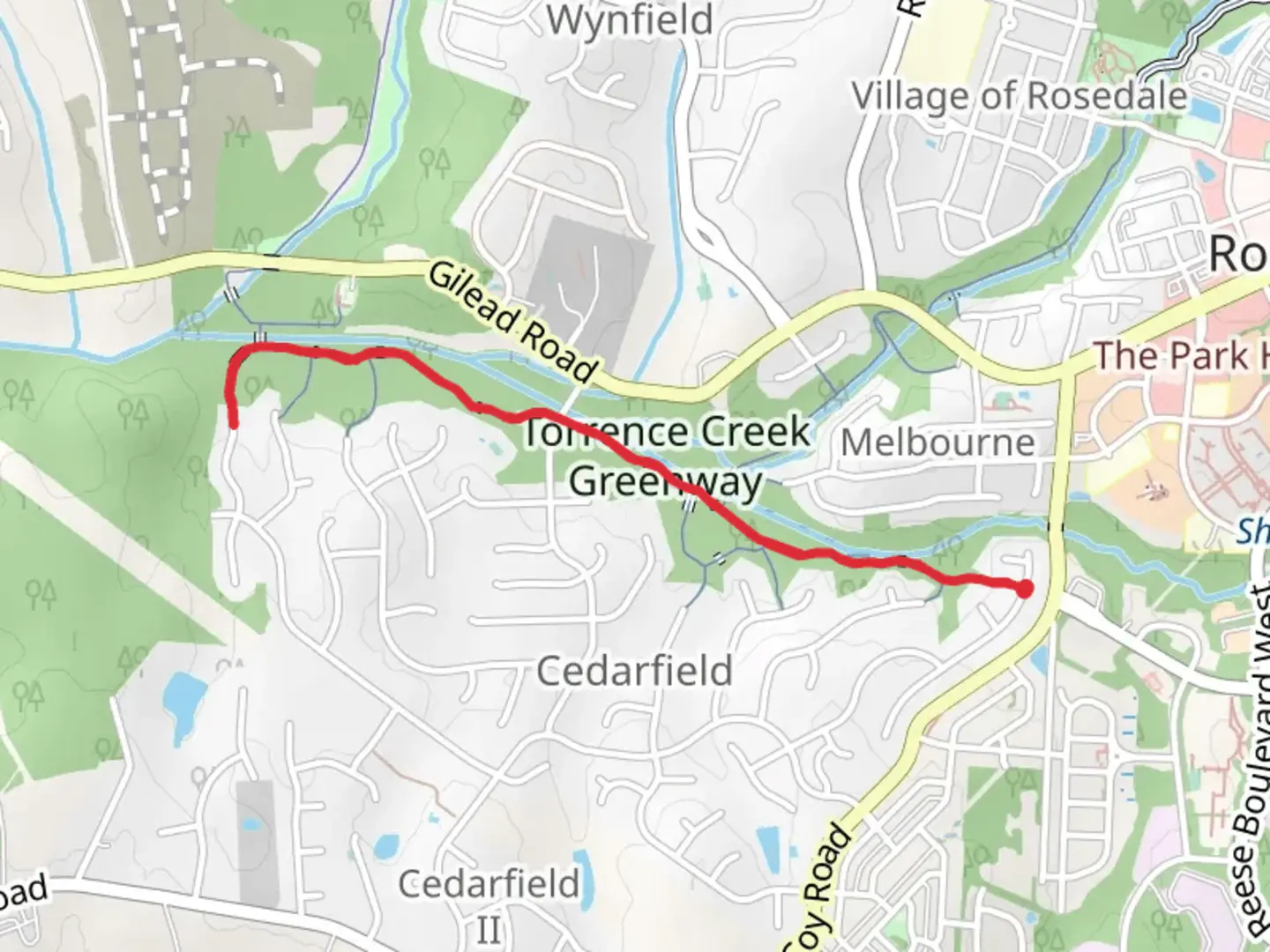 An image depicting the trail Torrence Creek Greenway and its surrounding area.