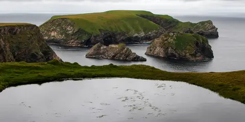An image depicting the trail Carrowteige - Beach Loop and its surrounding area.