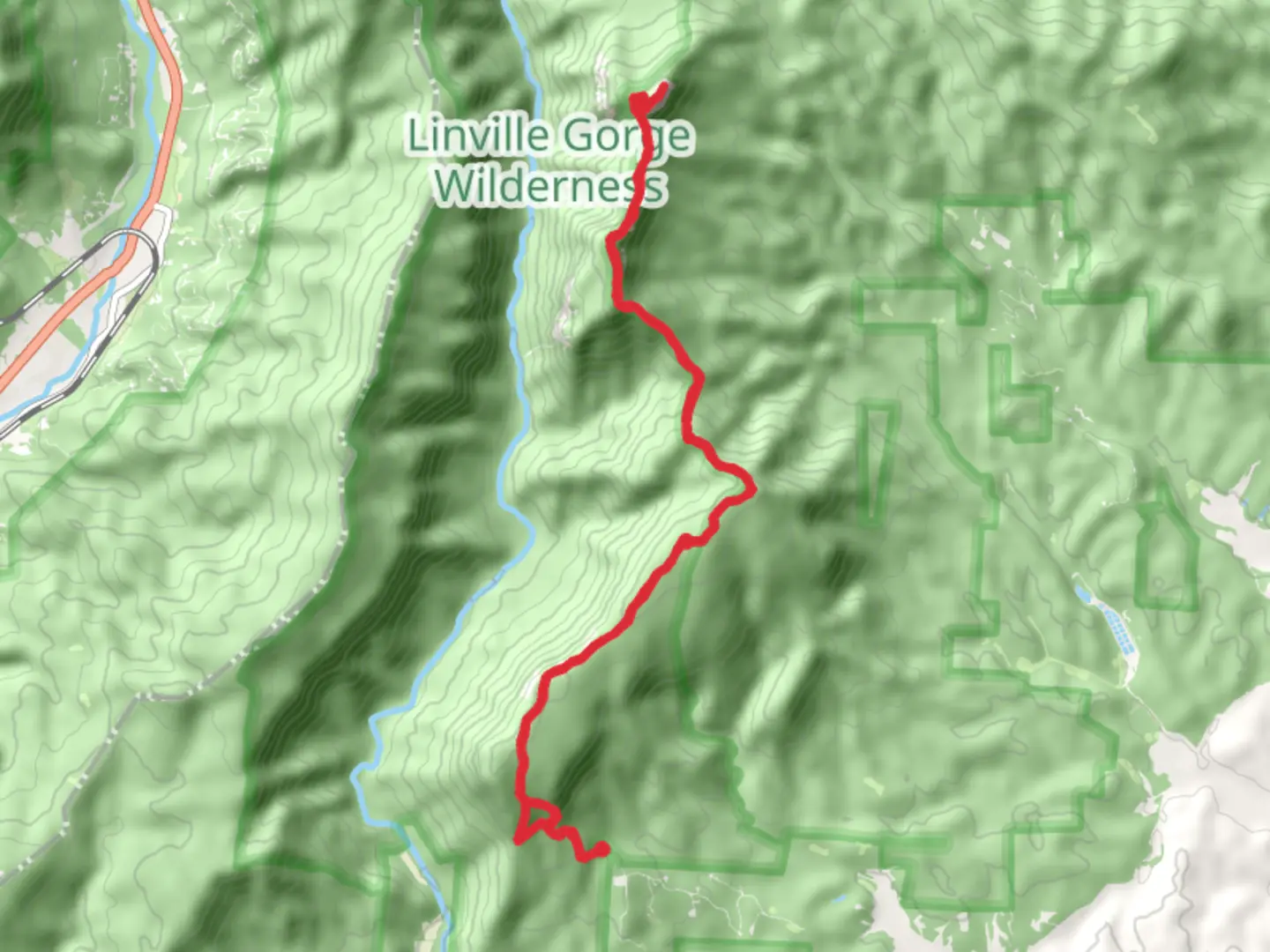 An image depicting the trail Table Rock Mountain via Mountain-to-Sea Trail and its surrounding area.