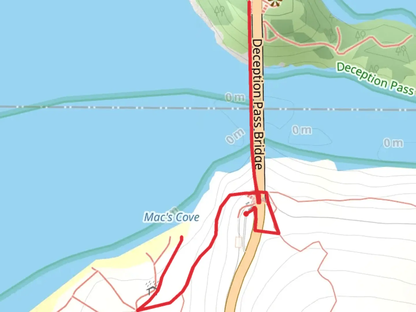 An image depicting the trail Mac's Cove and Deception Pass Bridge Walk and its surrounding area.