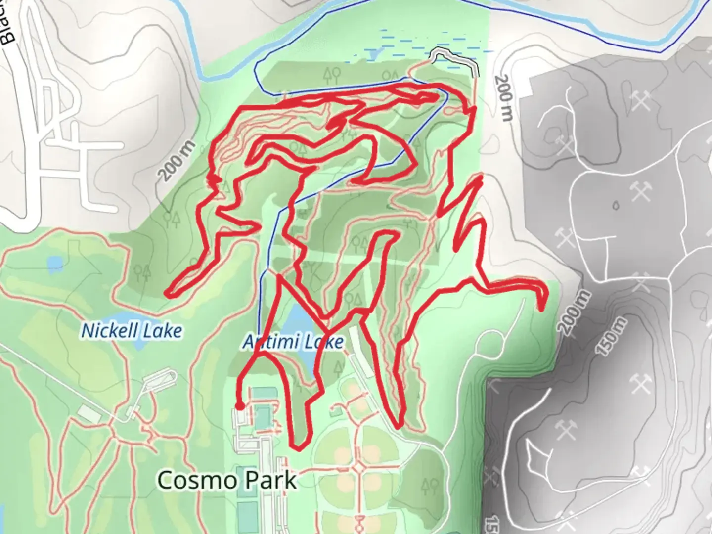 An image depicting the trail Antimi Lake via Cosmo Park Trail and its surrounding area.