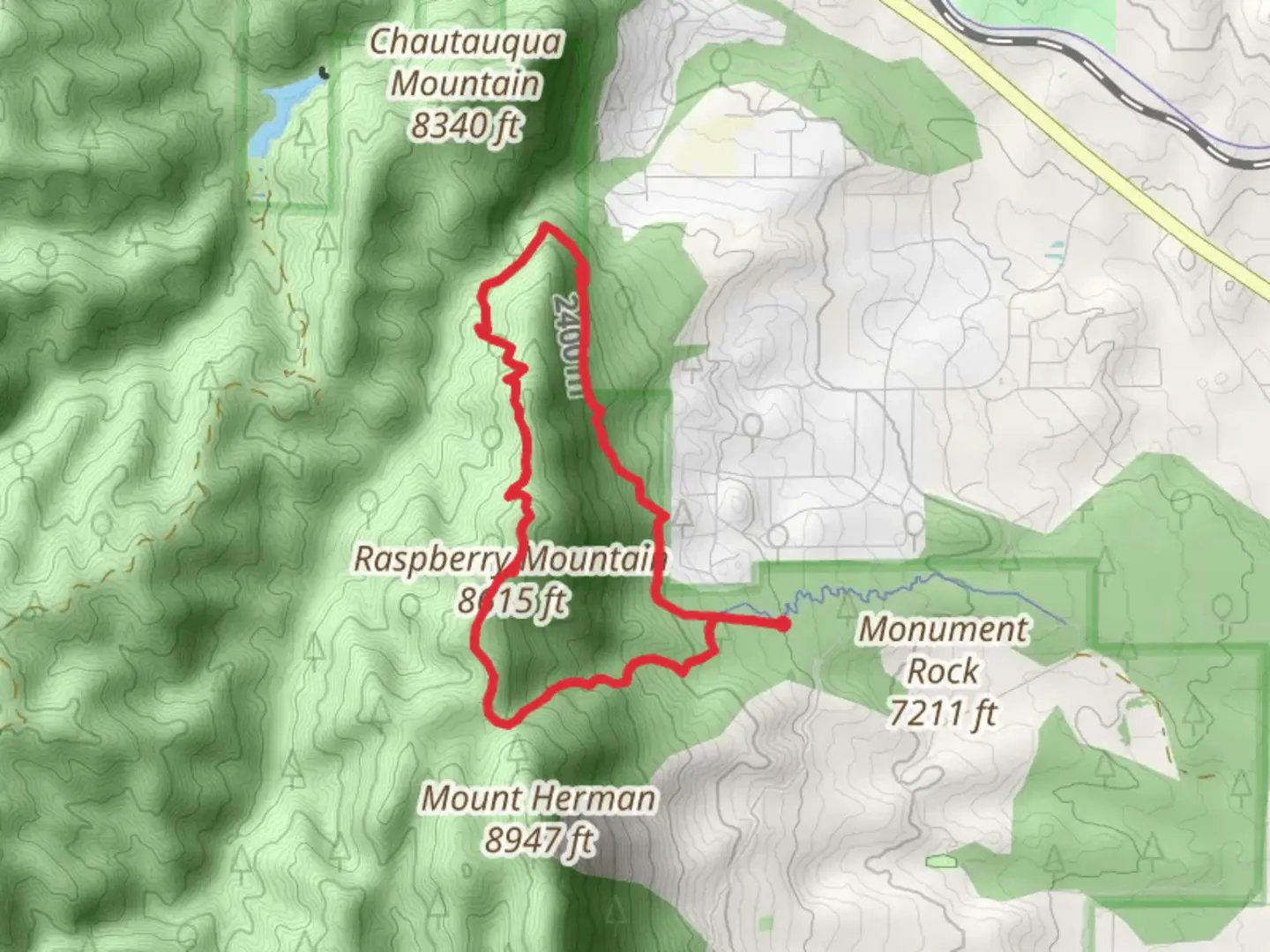 An image depicting the trail Raspberry Mountain and White Ghost Loop Trail and its surrounding area.