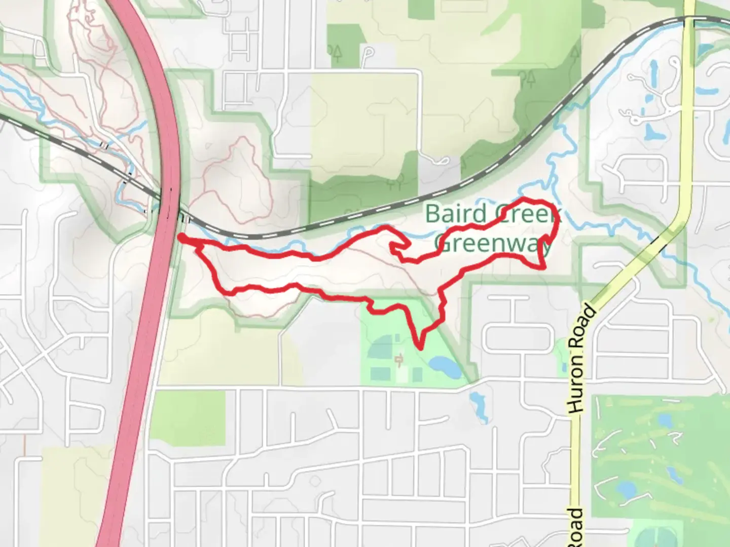 An image depicting the trail Baird Creek Multi-Use Loop Trail and its surrounding area.