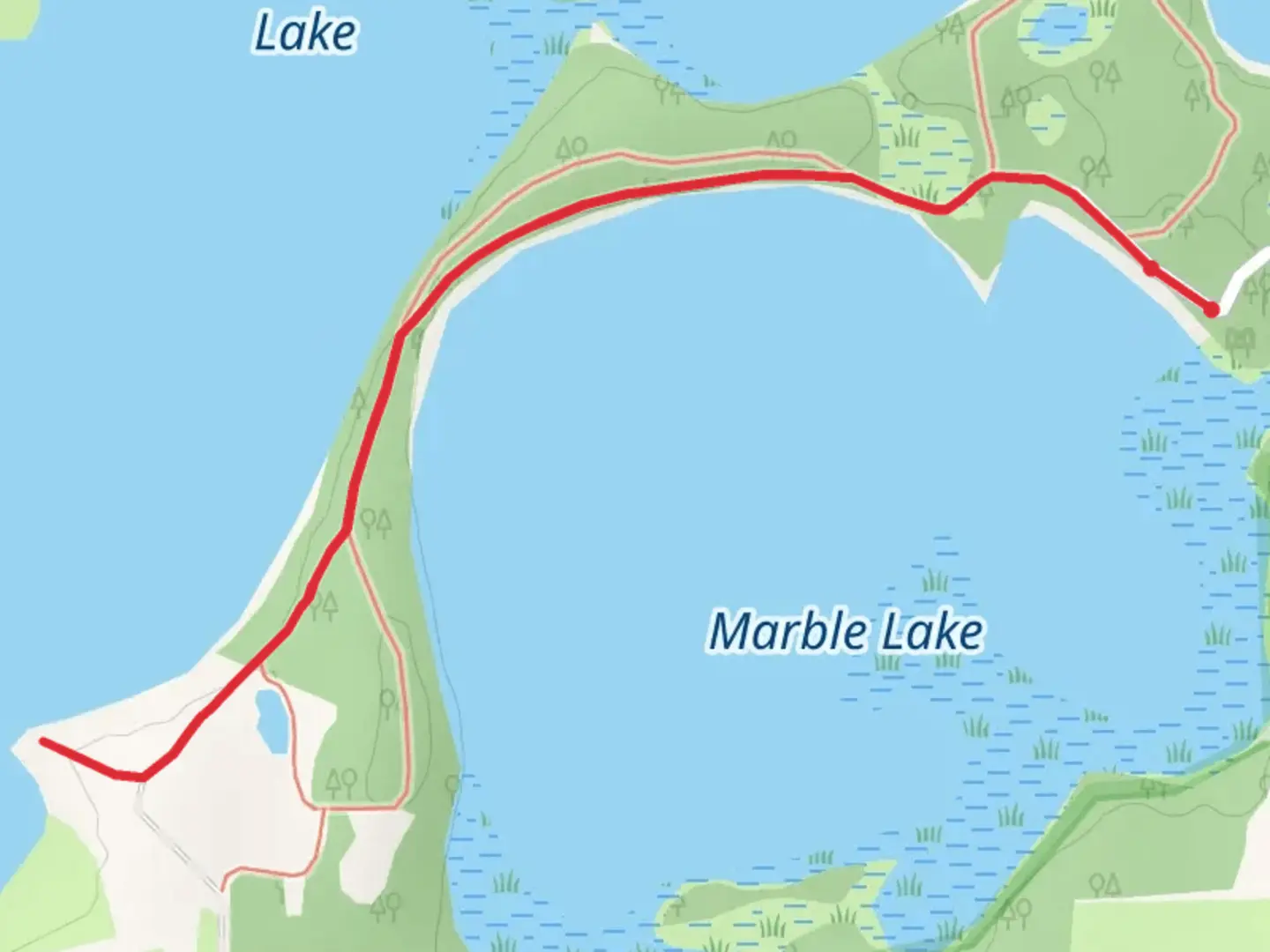 An image depicting the trail Walk along Marble Lake and its surrounding area.