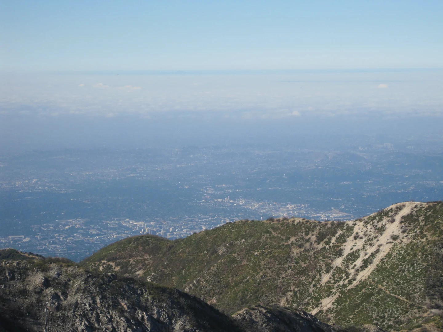 An image depicting the trail Eaton and Markham Saddle via Altadena Crest Trail and its surrounding area.