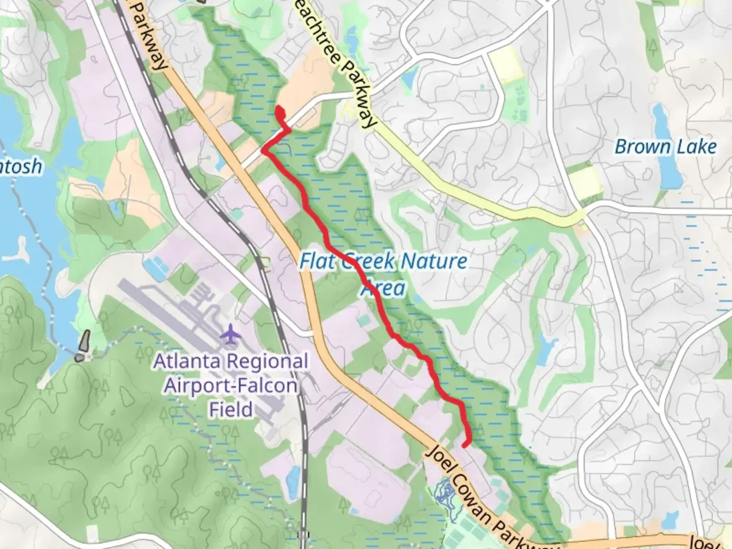 An image depicting the trail Flat Creek Nature Area and its surrounding area.