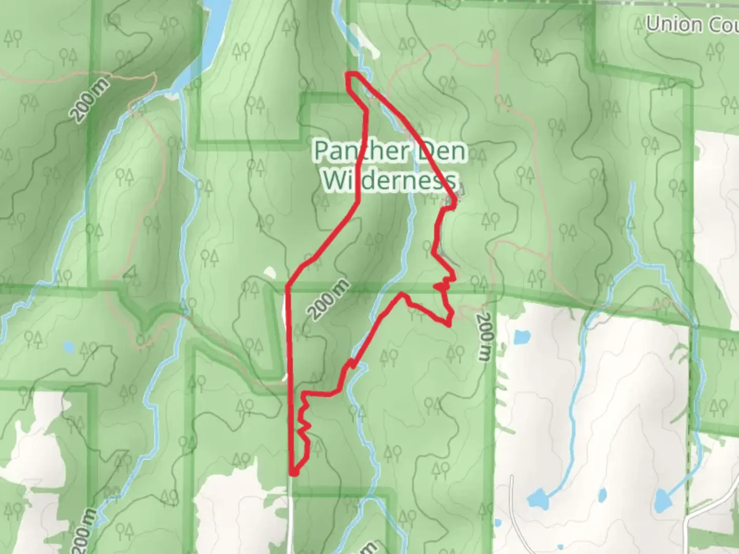 An image depicting the trail Panther Den Loop Trail and its surrounding area.