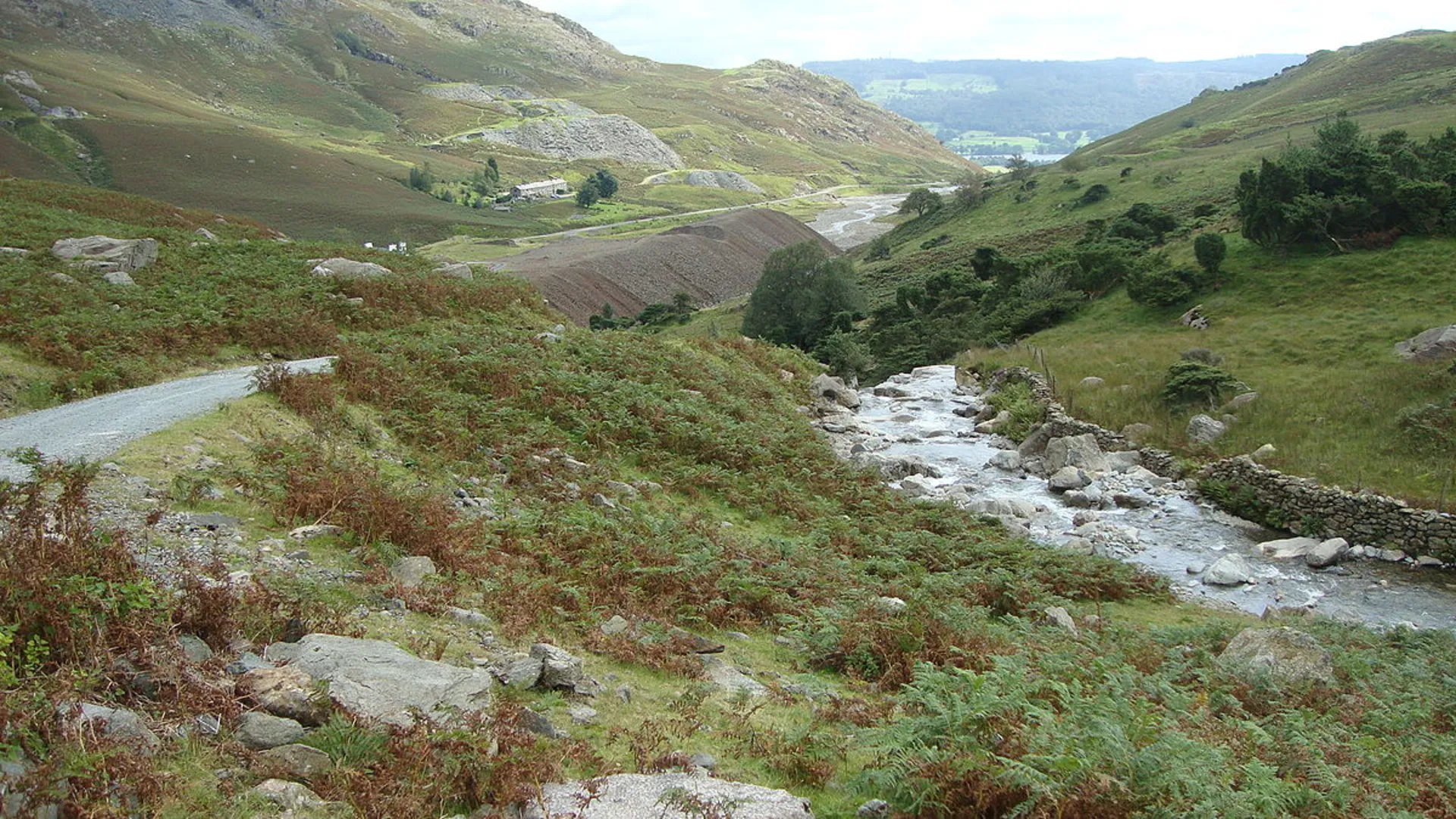 An image depicting the trail Old Man of Coniston Walk via Coniston Waterfall and its surrounding area.