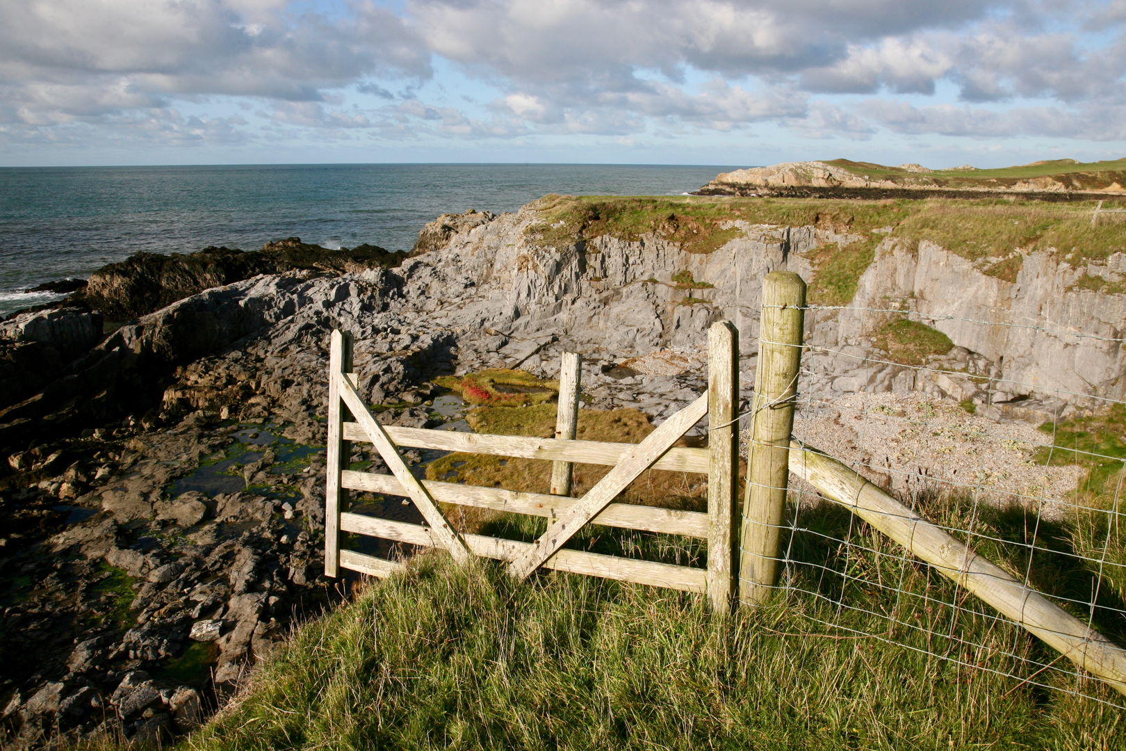 An image depicting the trail Anglesey Coastal Path and its surrounding area.