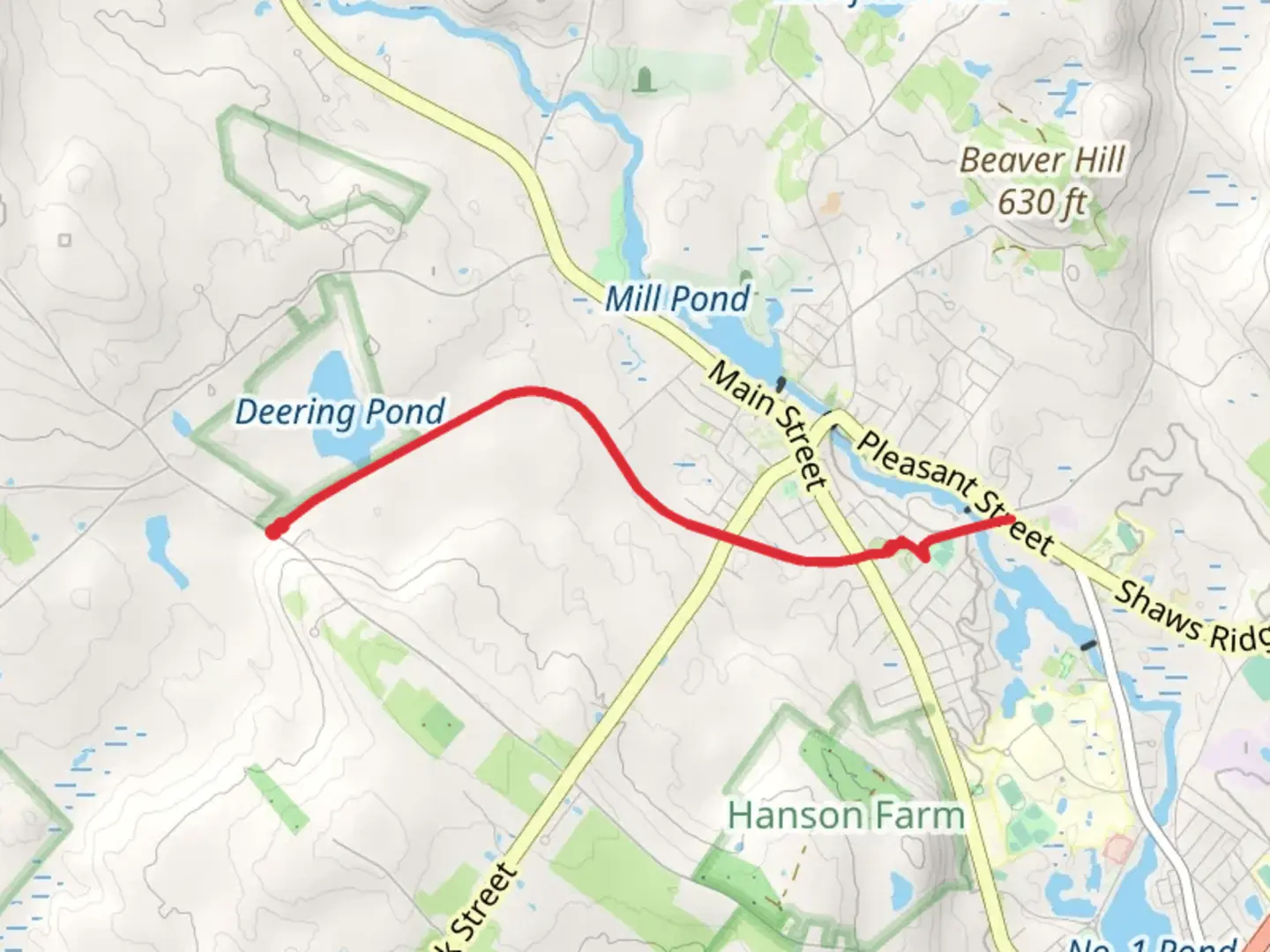An image depicting the trail Sanford-Springvale Rail Trail from Deering Pond and its surrounding area.