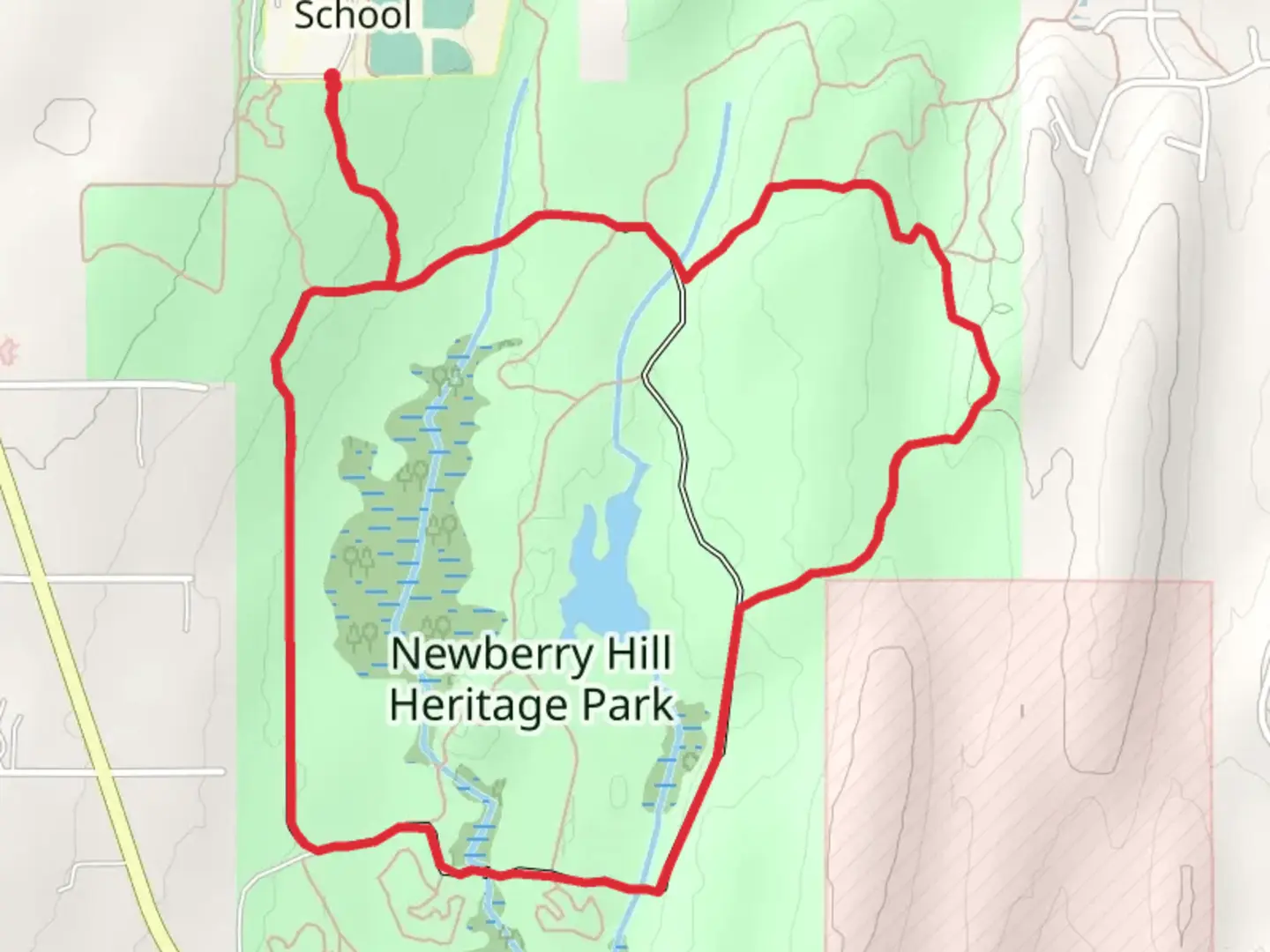 An image depicting the trail Newberry Hill Heritage Park and Rhodie Hill Loop and its surrounding area.