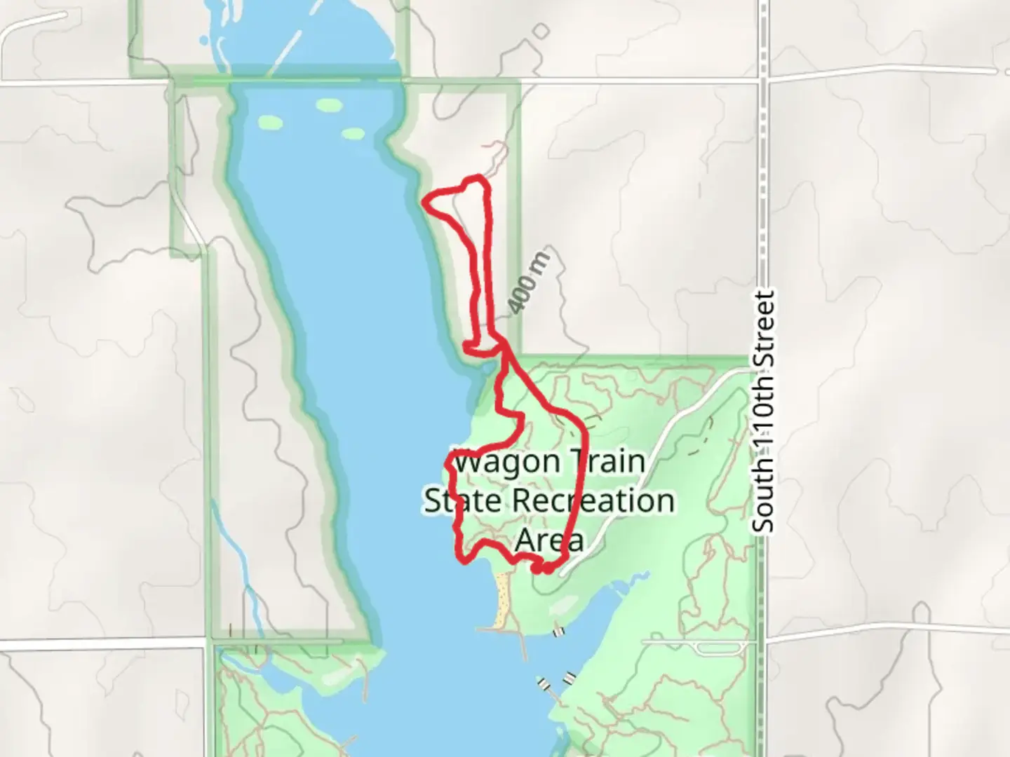 An image depicting the trail Wagon Train State Recreation Area Shore Loop and its surrounding area.