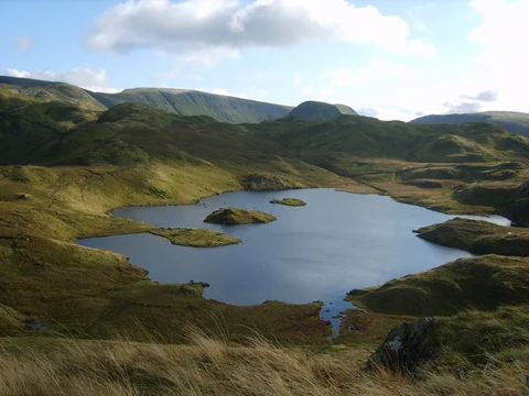 An image depicting the trail Rossett Pike, Angle Tarn and Stake Pass Loop from Old Dungeon Ghyll Hotel and its surrounding area.