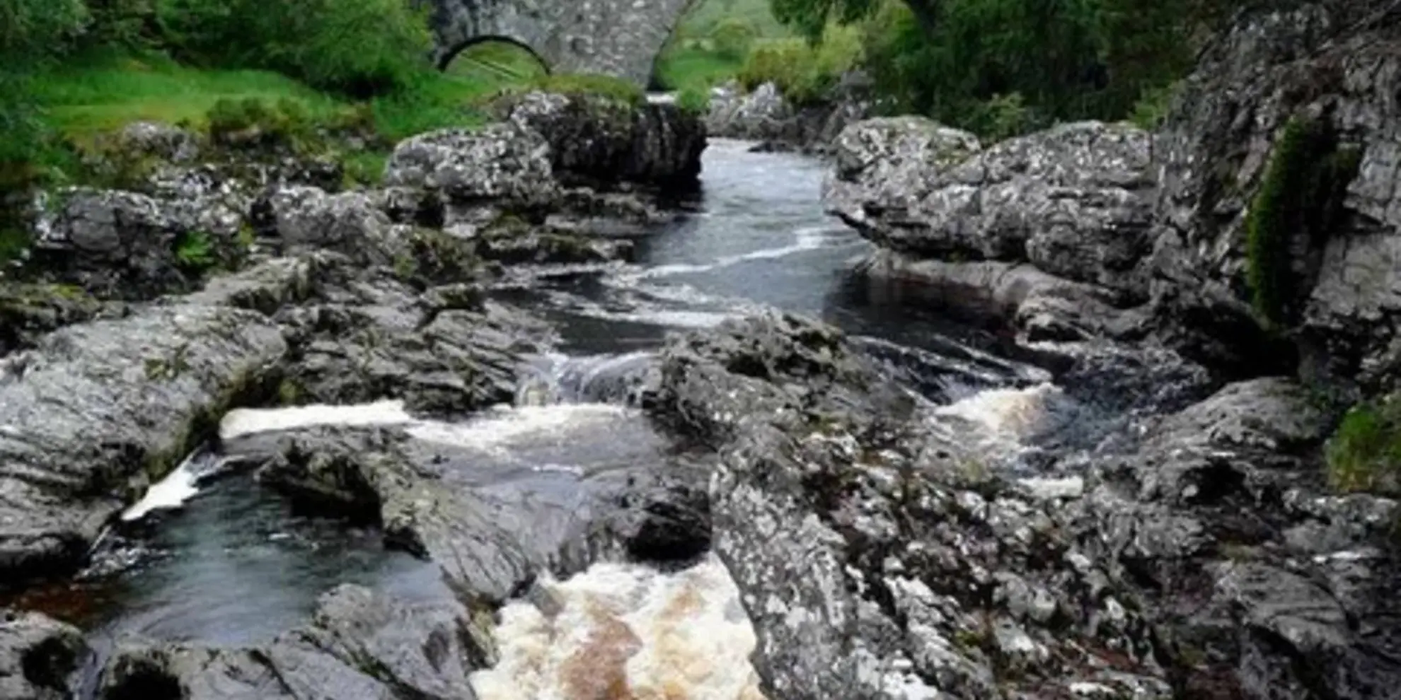 An image depicting the trail Laggan Path - Falls of Truim and its surrounding area.