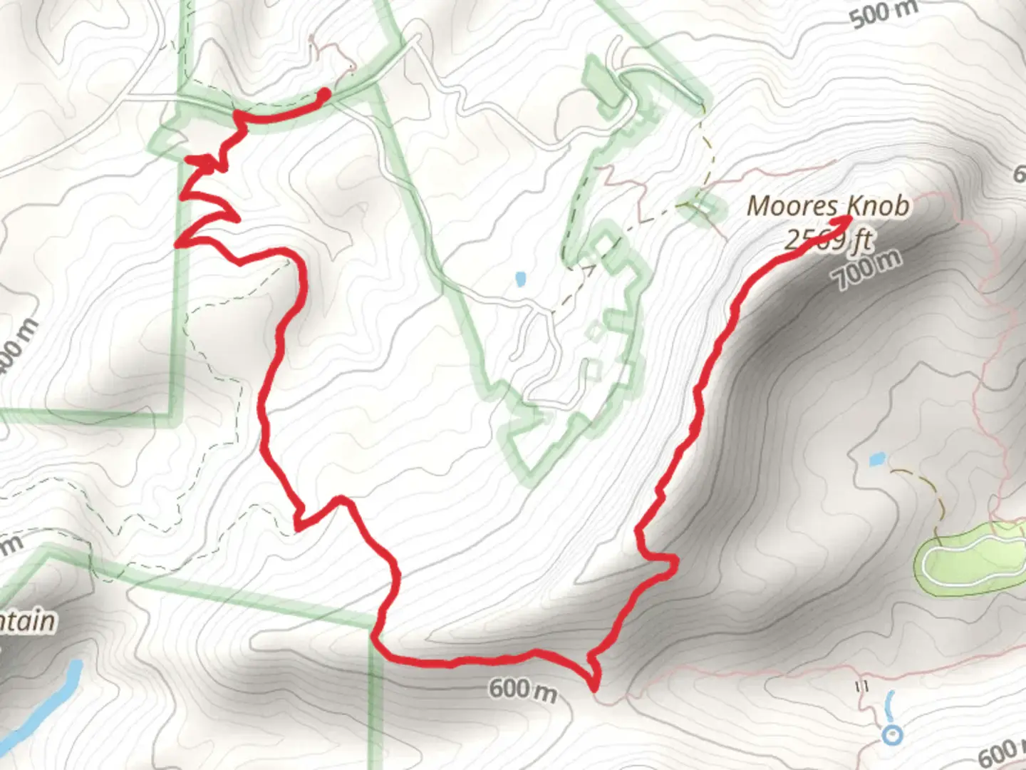 An image depicting the trail Moores Knob via Moores Wall Loop Trail and its surrounding area.