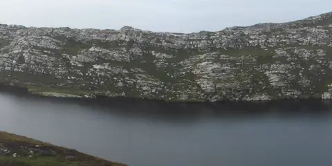 An image depicting the trail Sheep's Head - Lighthouse Loop and its surrounding area.