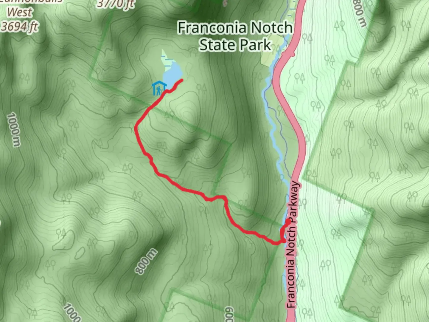 An image depicting the trail Lonesome Lake and its surrounding area.
