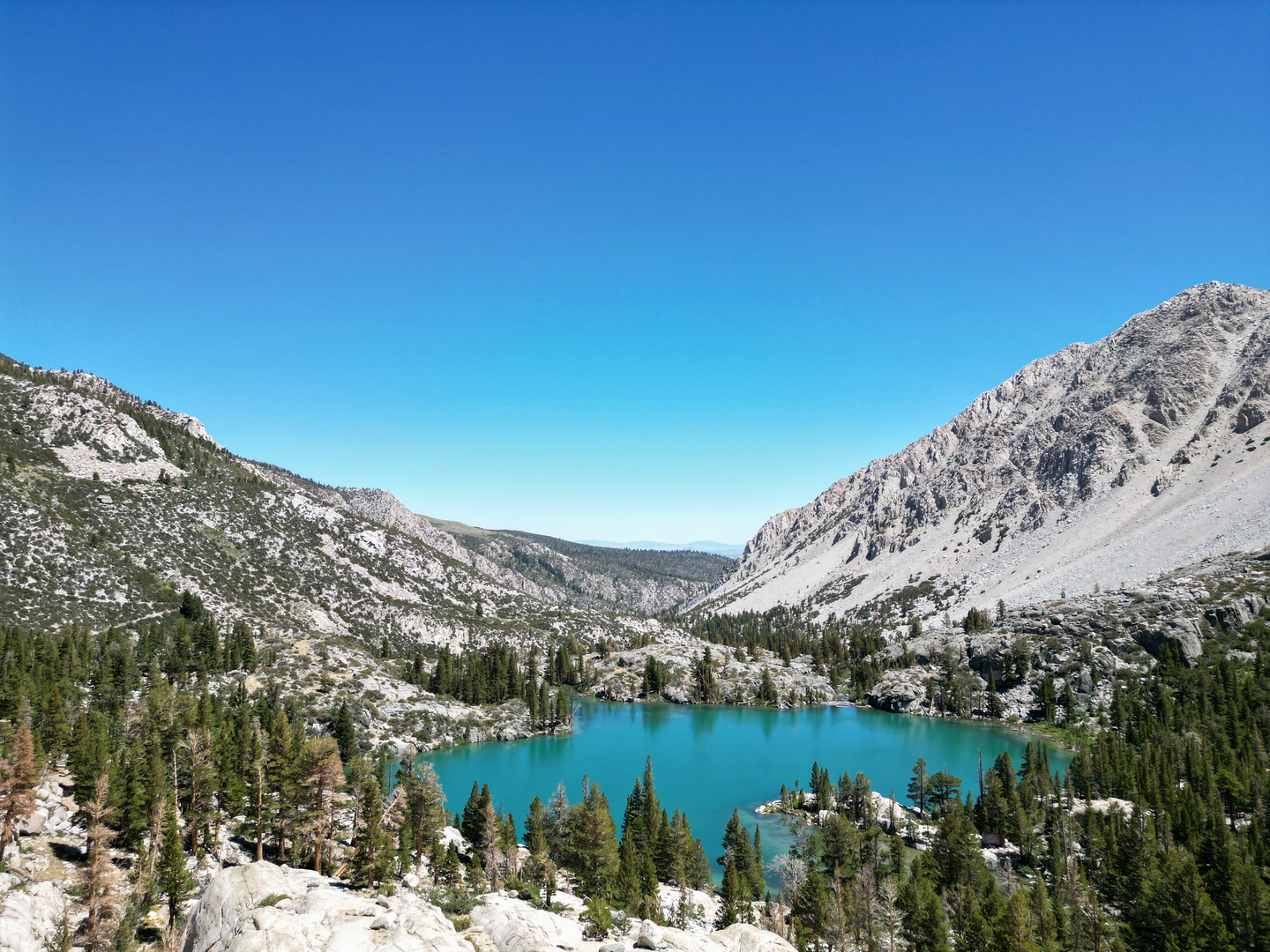 An image depicting the trail First, Second and Third Lakes via North Fork Big Pine Creek Trail and its surrounding area.