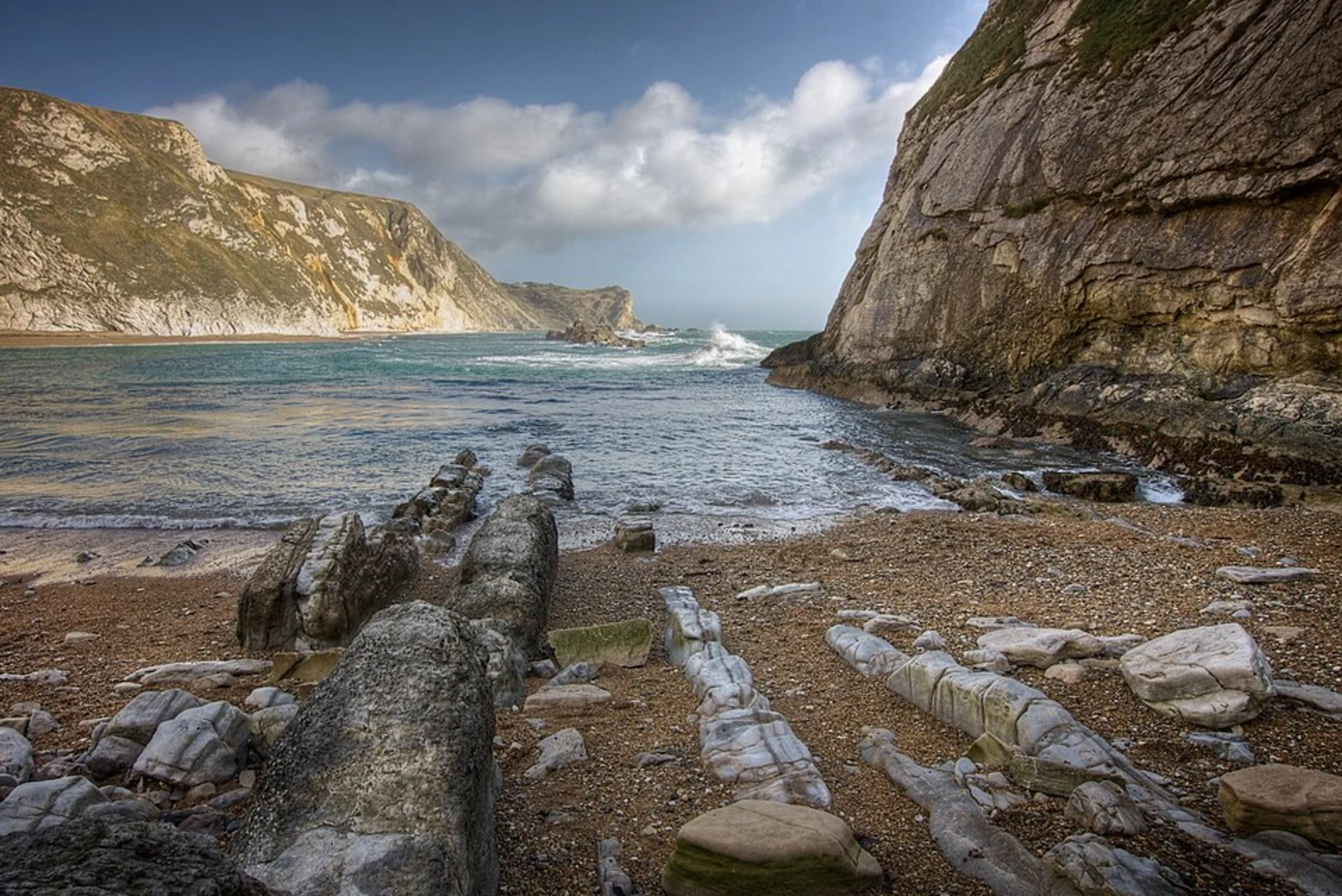 An image depicting the trail Lulworth Cove, Bat's Head, Butter Rock and Man O' War Beach Loop and its surrounding area.