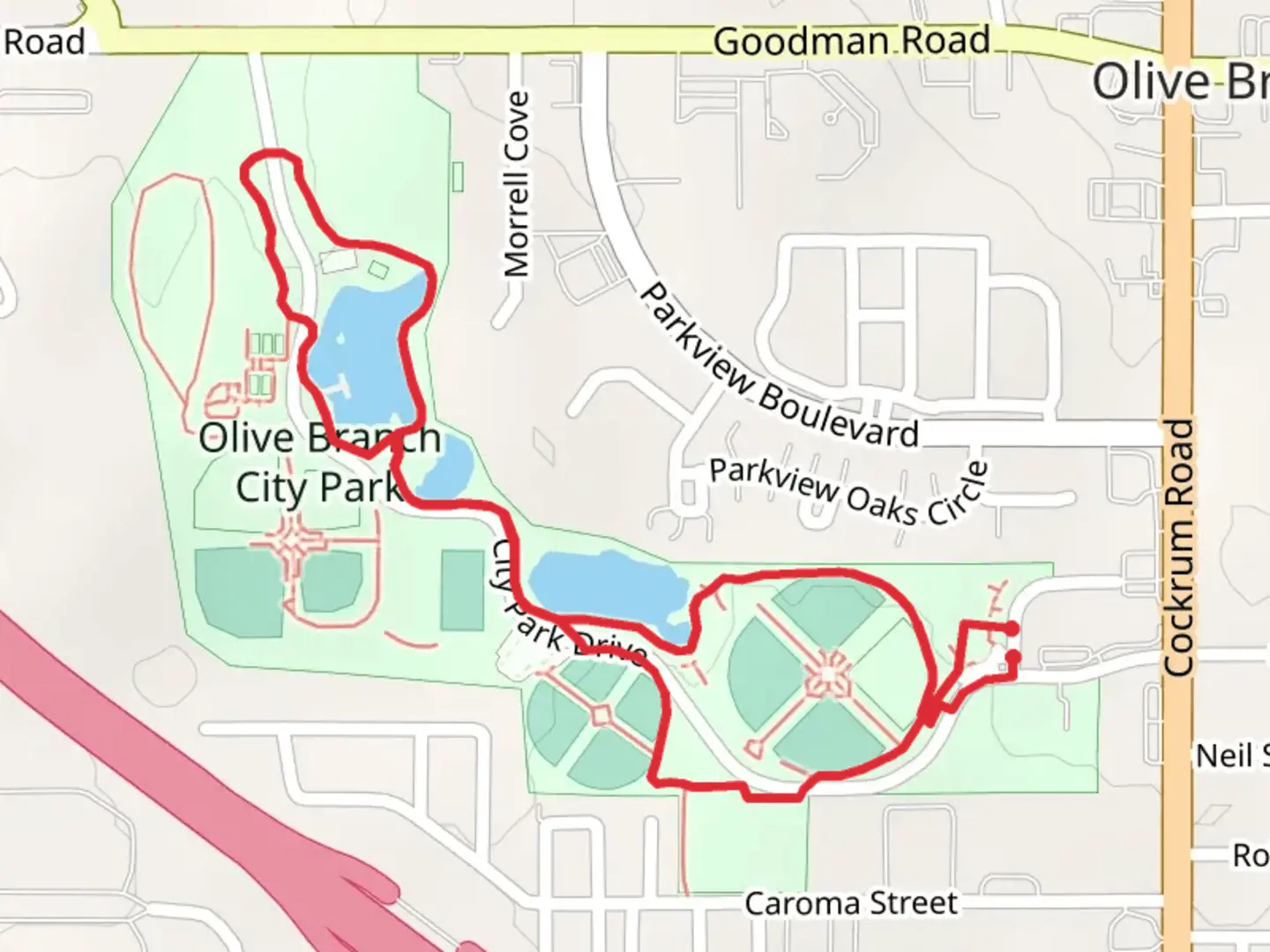 An image depicting the trail Olive Branch City Park Loop and its surrounding area.