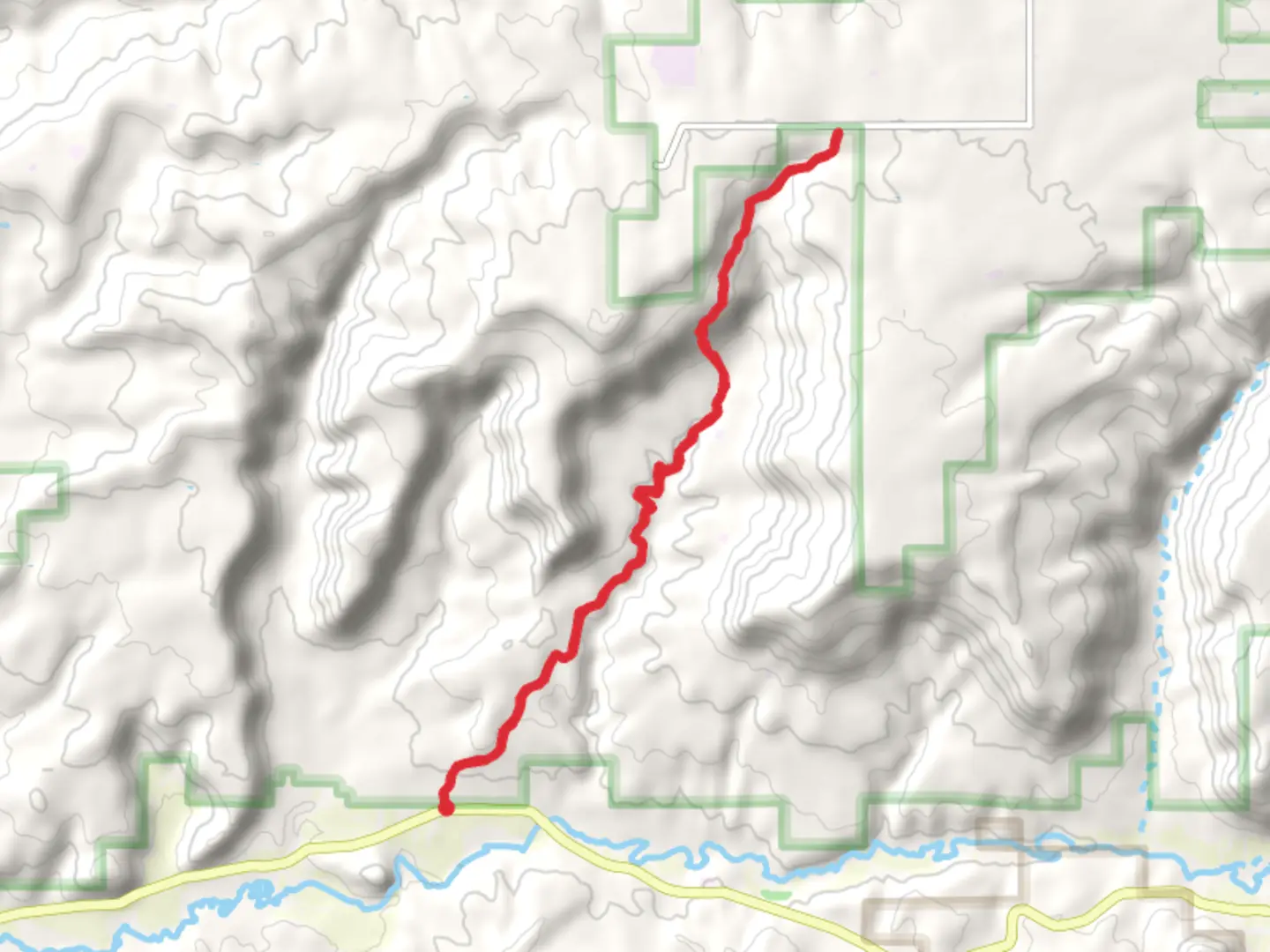 An image depicting the trail Ismay Trading Post Road and its surrounding area.