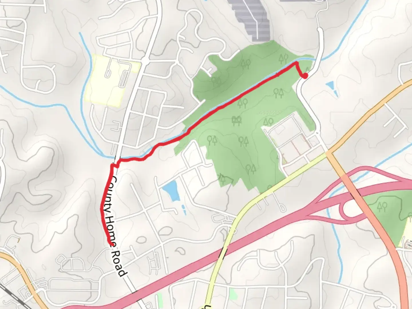 An image depicting the trail Lyle Creek Greenway and its surrounding area.