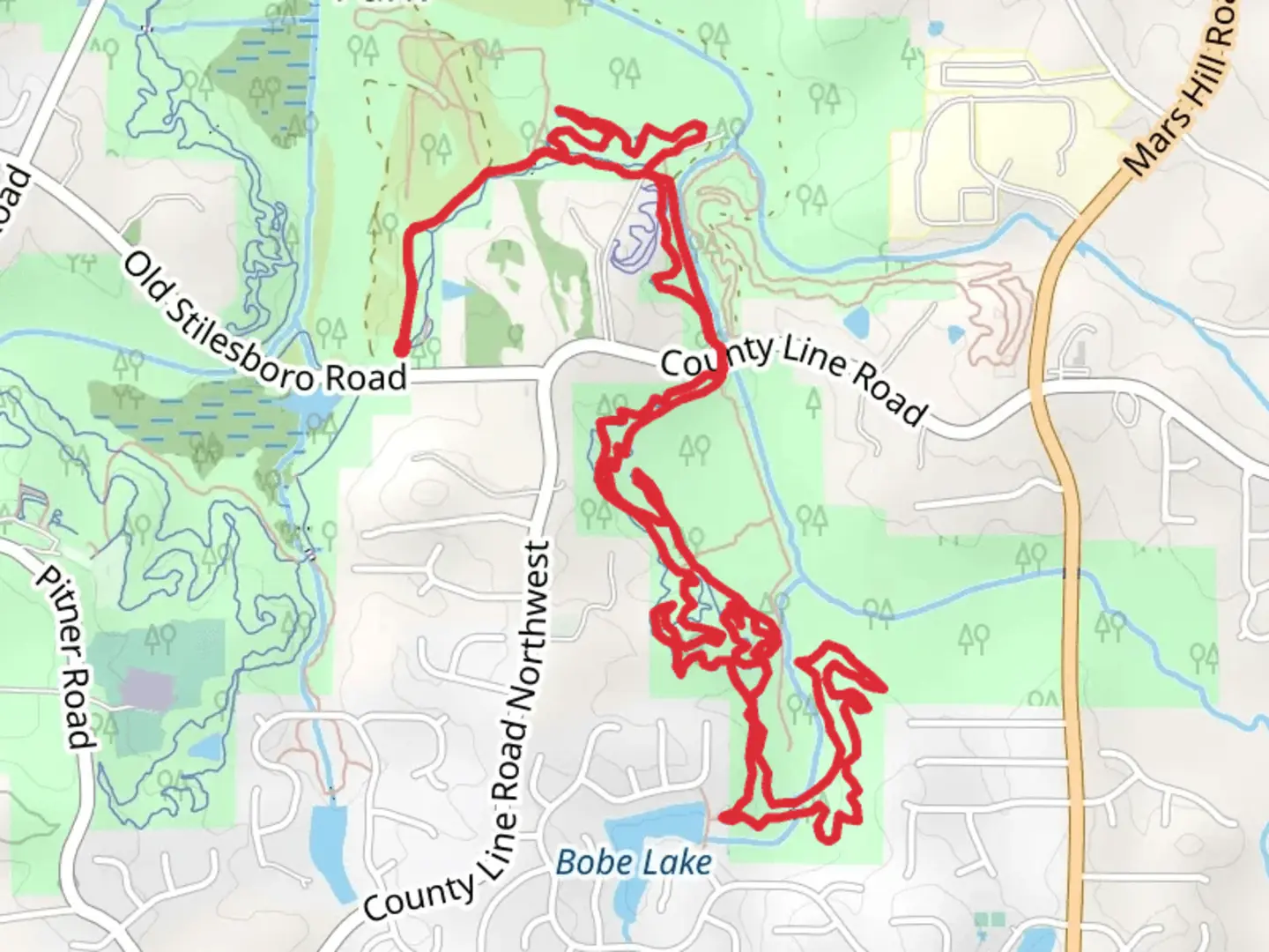An image depicting the trail Mason's Bridge and Mason's Bluff Loop and its surrounding area.