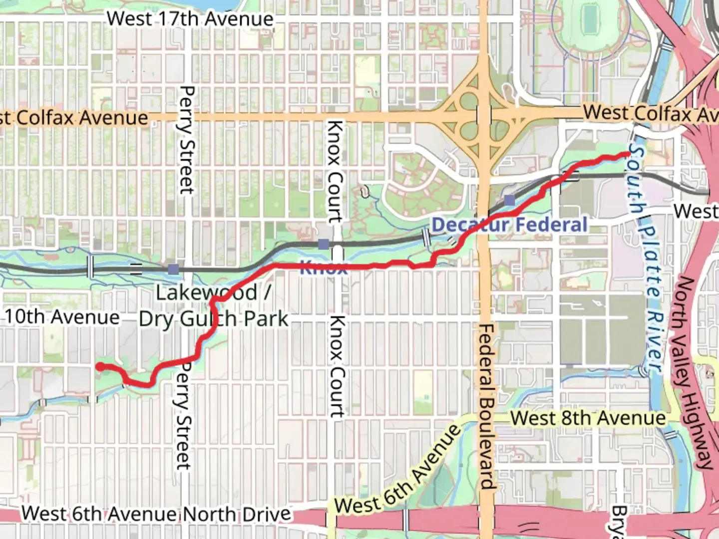 An image depicting the trail Lakewood Gulch from Martinez Park and its surrounding area.