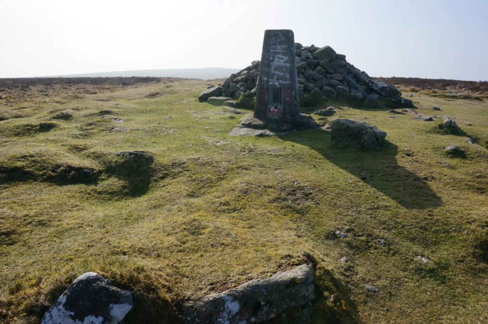 An image depicting the trail Widecombe in the Moor to Bovey Tracey Walk and its surrounding area.
