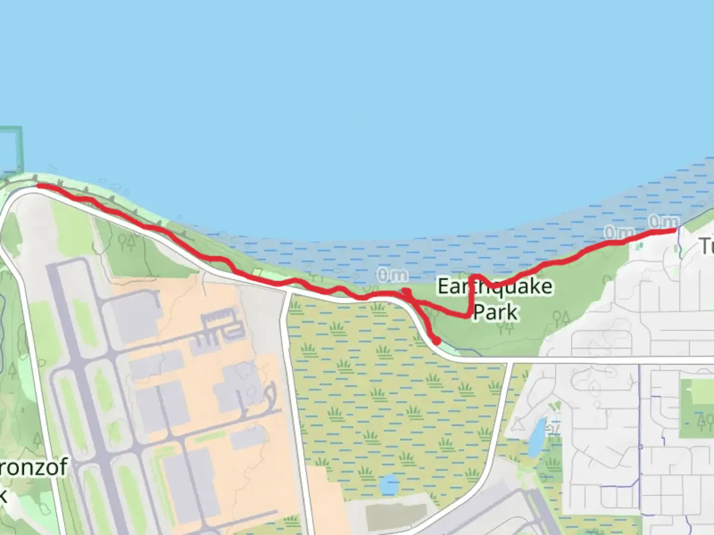 An image depicting the trail Earthquake Park - Tony Knowles Coastal Trail and its surrounding area.