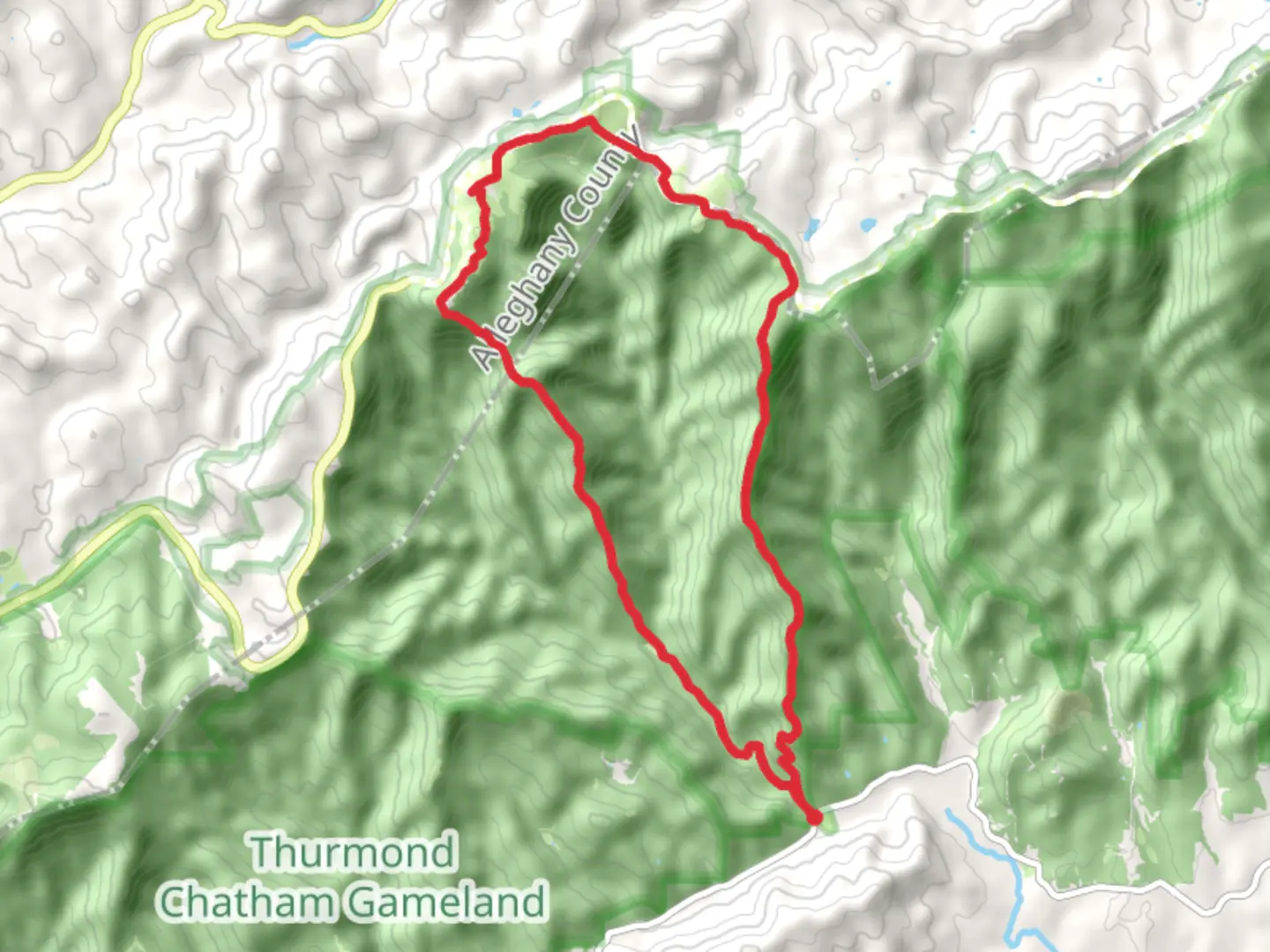 An image depicting the trail Grassy Gap Fire Road, Brooks Knob, Bluff Mountain and Cedar Ridge Loop Trail and its surrounding area.