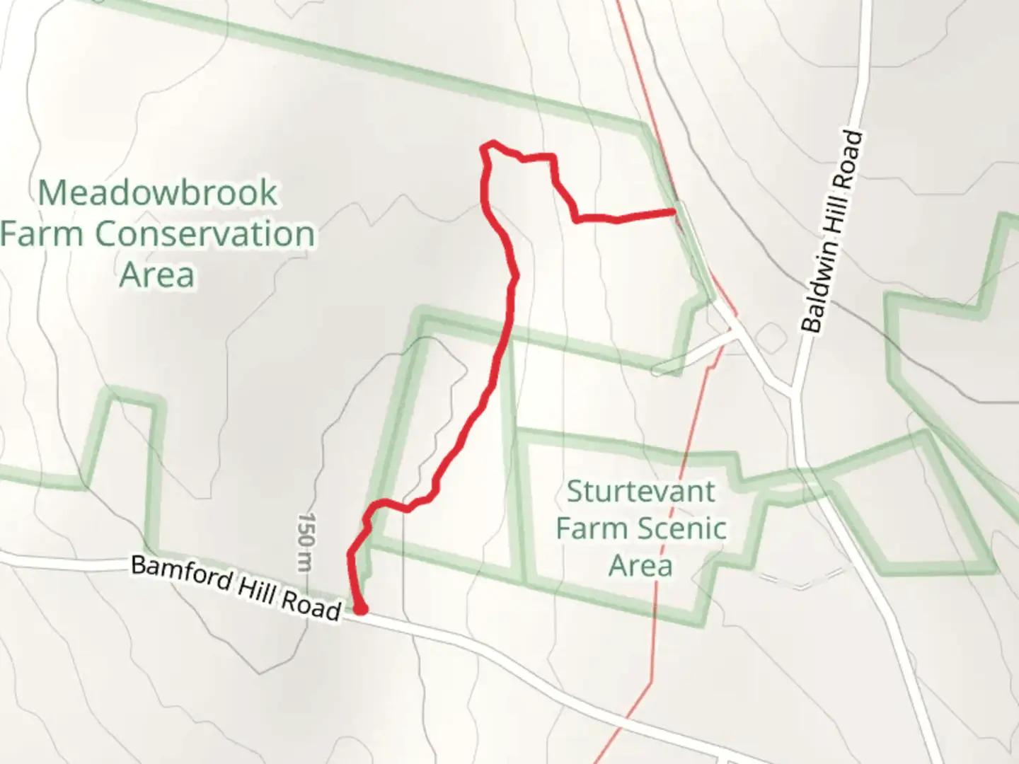 An image depicting the trail Meadowbrook Farm Conservation Area Trail and its surrounding area.