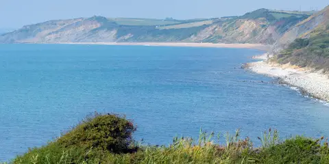 An image depicting the trail England Coast Path - Portland to Lulworth Cove and its surrounding area.