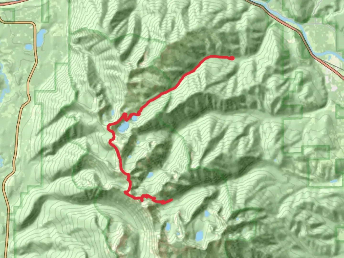An image depicting the trail Cabinet Divide North Trail via Cedar Creek Trail and its surrounding area.