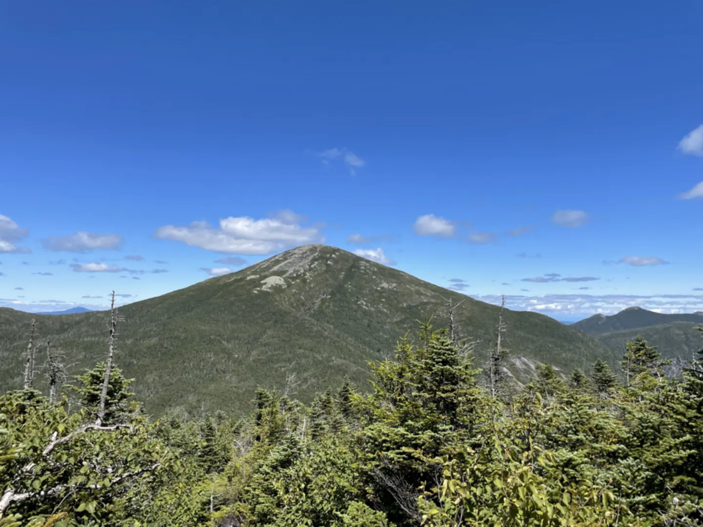 An image depicting the trail Lake Tear of the Clouds and Mount Marcy Trail and its surrounding area.